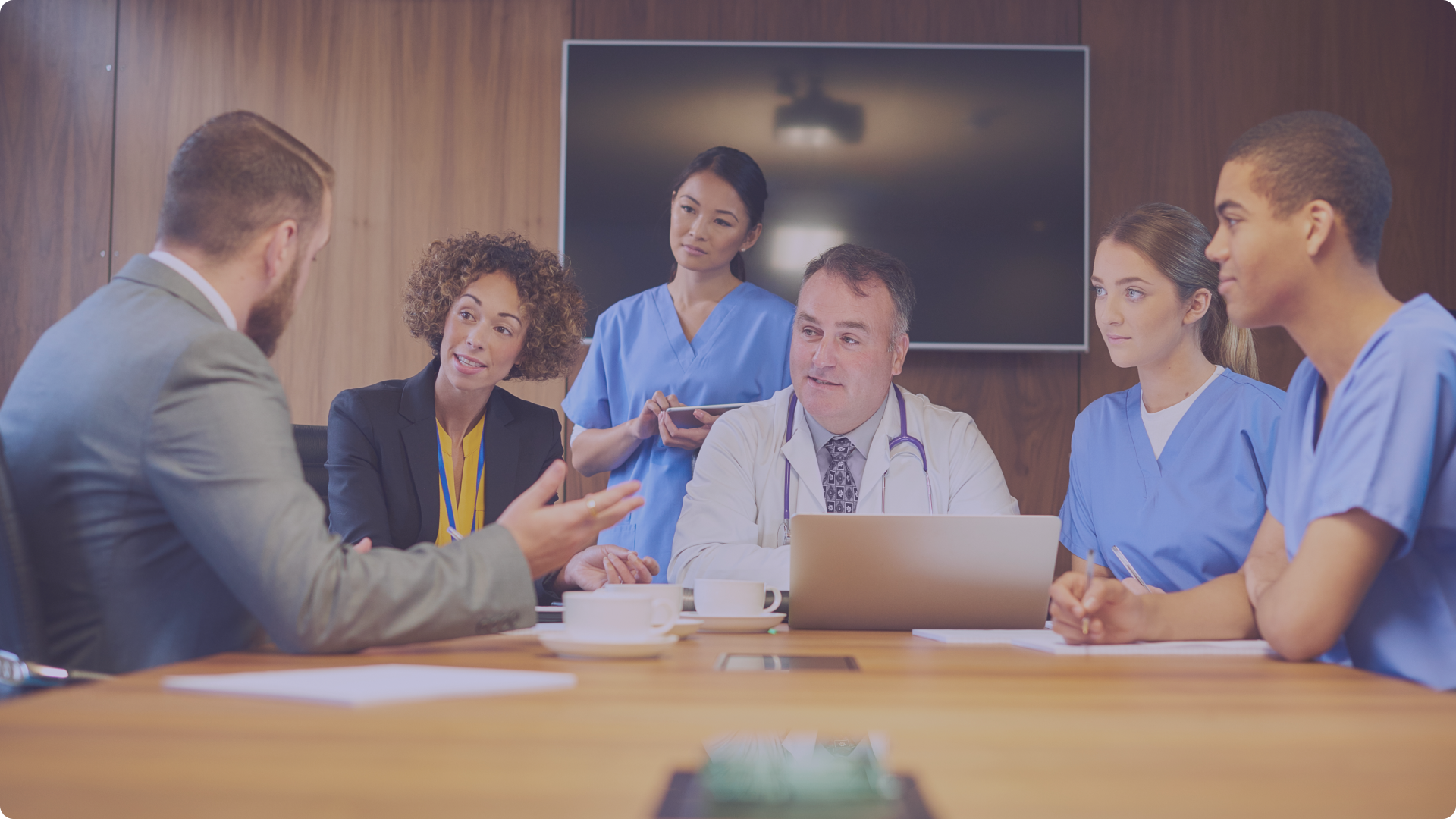 Image of hospital administrators who use BookJane J360 Workforce in a boardroom